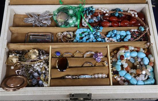 A jewellery box containing assorted costume jewellery.